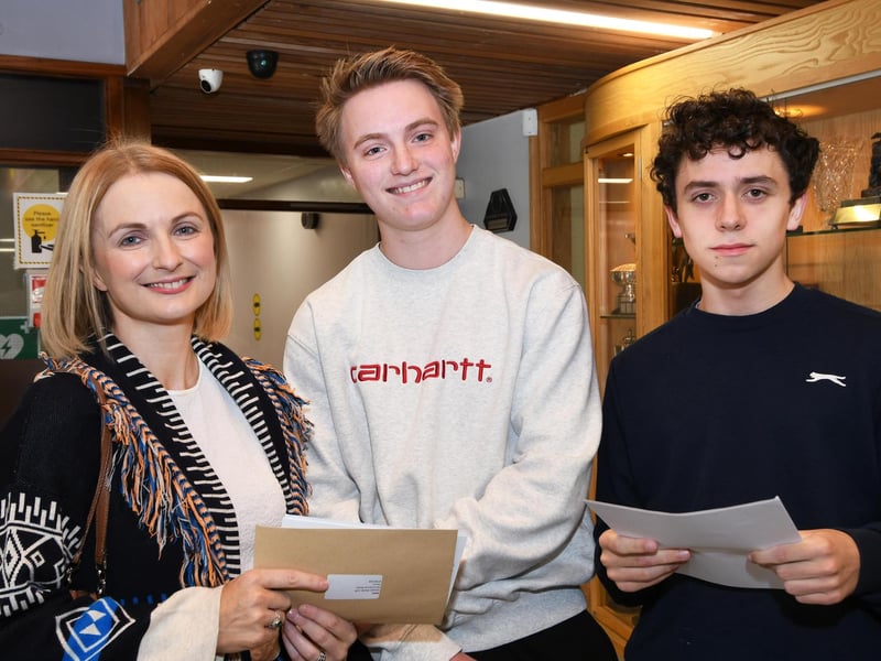 Proud mum Ciara Devlin pictured with her son Joey, centre, and his pal Donal Mooney when they picked up their GCSE results at St. Columb's College.