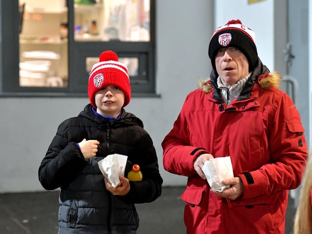 Derry City fans enjoying some chips at Derry City’s game against Cork City. Photo: George Sweeney. DER2308GS – 135