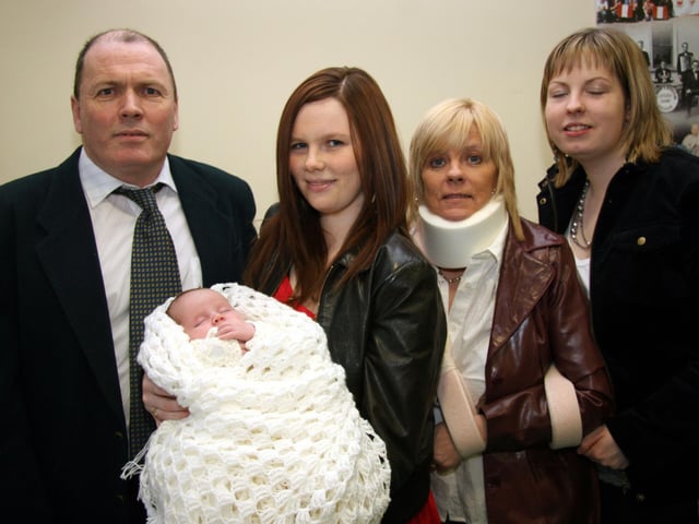 The McGinley family pose for a photograph with baby Gerard on the occasion of his Christening 0022JML : Parties and nights out in March 2006