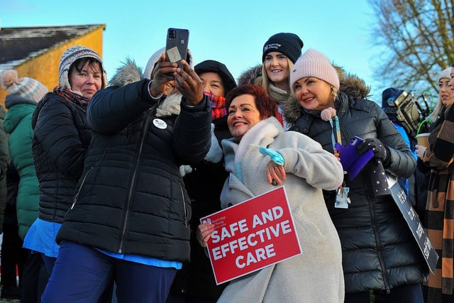 Royal College of Nurses members, campaigning for fair pay and conditions, pose for a selfie  during industrial action at Altnagelvin Hospital on Thursday morning.  Photo: George Sweeney. DER2250GS - 35