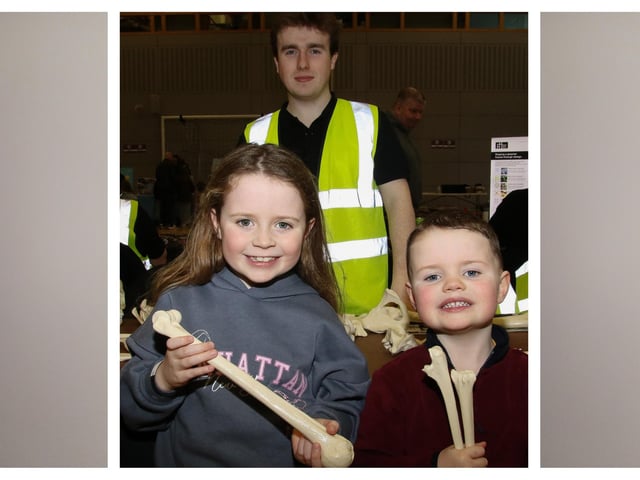 Brody McEvoy from CAPNI, with Evie and Charlie checking out skelton bones at The Foyle Science Showcase held in The Foyle Arena. (Photo - Deirdre Heaney, nwpresspics). Foyle Arena Science Showcase.