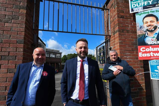 The SDLP leader Colum Eastwood, accompanied by colleague Colr Brian Tierney, leaves The Model Primary School after casting his vote in the Westminster general election. Photo: George Sweeney.