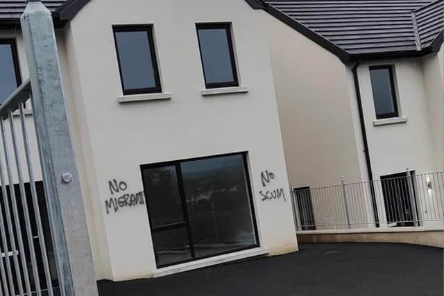 'No migrants' was sprayed on housing on Church Brae in Derry. The PSNI are treating the incident as a hate crime.