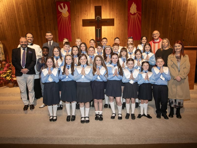 Mr. McNulty's class from Hollybush Primary School, who received the Sacrament of Confirmation from Monsignor Joseph Donnelly at Our Lady of Lourdes Church, Steelstown on Wednesday evening last. Included in photo is Fr. Declan McGeehan, Mr. Feargal Friel, Acting Principal, Mr. Matt McNulty, teacher and classroom assistants Ms. Danielle Kelly and Ms. Elaine French.. (Photo: Jim McCafferty Photography)