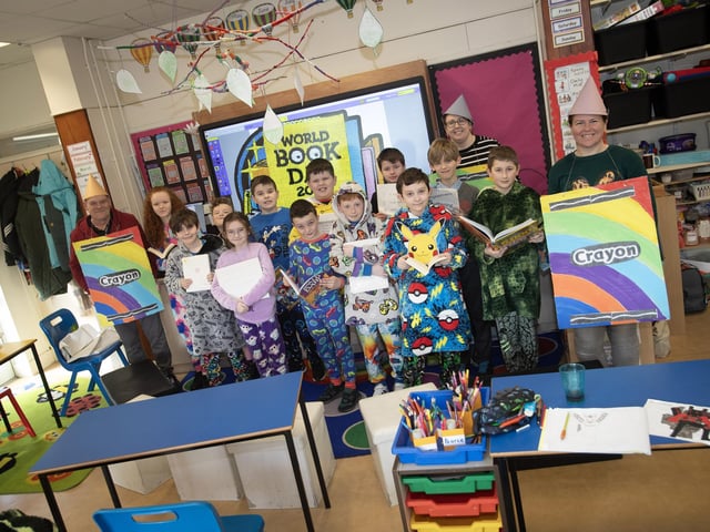 Teacher Mrs Danielle McLaughlin pictured with her class celebrating World Book Day at St. Brigid's PS on Thursday last. Included is Mr. John Donnelly and Helena Deighan, Classroom Assistants.