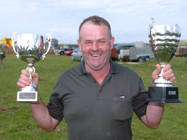 Eamon Noone, Clonmany, winner of the Best Suckler Cow, Best Heifer Calf and overall champion confined at Clonmany Show. (0508A29) : Clonmany Festival, Vintage Show, Agricultural Show and Raft Race in August 2005.
