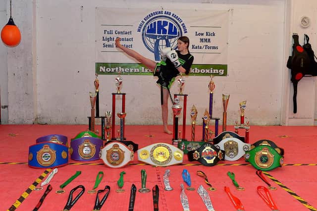 Champion kickboxer Annie Murphy, from the Top Ring Kickboxing Gym, pictured with the belts, medals and trophies she has won. Photo: George Sweeney. DER2248GS – 48