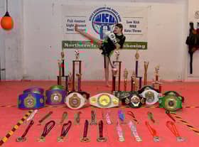 Champion kickboxer Annie Murphy, from the Top Ring Kickboxing Gym, pictured with the belts, medals and trophies she has won. Photo: George Sweeney. DER2248GS – 48
