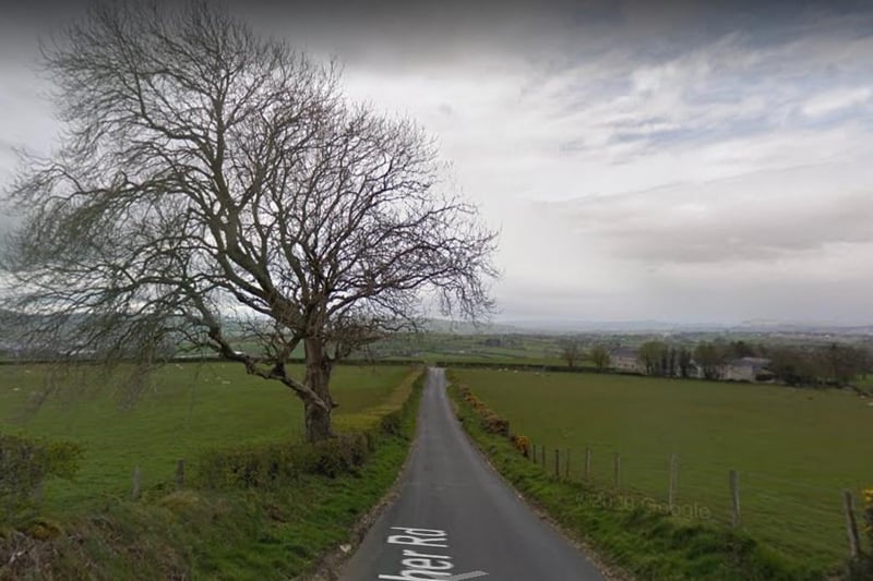 Heather Road (Bóthar an Fhraoigh Thoir). Named after the plant rather than the girls' name according to Bryson. There are two Heather Roads, one in Galliagh and one in Creevagh Lower/Upper (pictured).