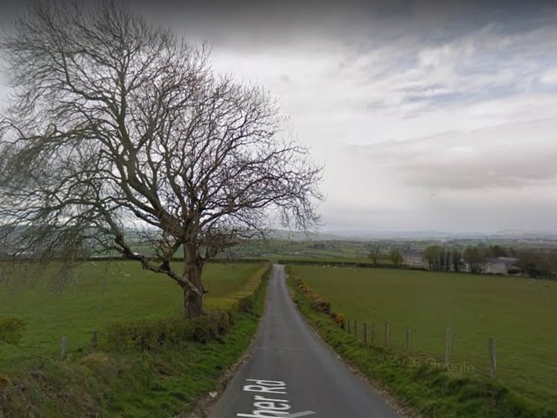 Heather Road (Bóthar an Fhraoigh Thoir). Named after the plant rather than the girls' name according to Bryson. There are two Heather Roads, one in Galliagh and one in Creevagh Lower/Upper (pictured).
