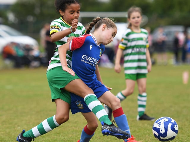 Top Of The Hill Celtic's Nyla Obinna tussles with Linfield forward Neiko Sloane during their girls under-9's match.