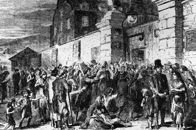 1846:  Starving peasants clamour at the gates of a workhouse during the Irish potato famine.  (Photo by Hulton Archive/Getty Images)