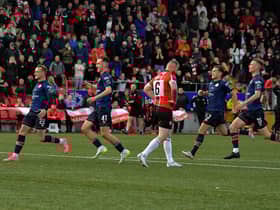 St Patrick’s Athletic players rush past a dejected Mark Connolly after his penalty miss in the FAI Cup game at the Brandywell on Sunday evening. Photo: George Sweeney. DER2334GS – 08