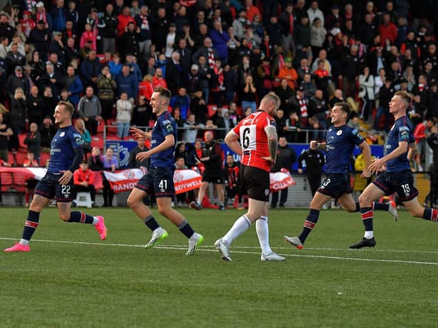 St Patrick’s Athletic players rush past a dejected Mark Connolly after his penalty miss in the FAI Cup game at the Brandywell on Sunday evening. Photo: George Sweeney. DER2334GS – 08