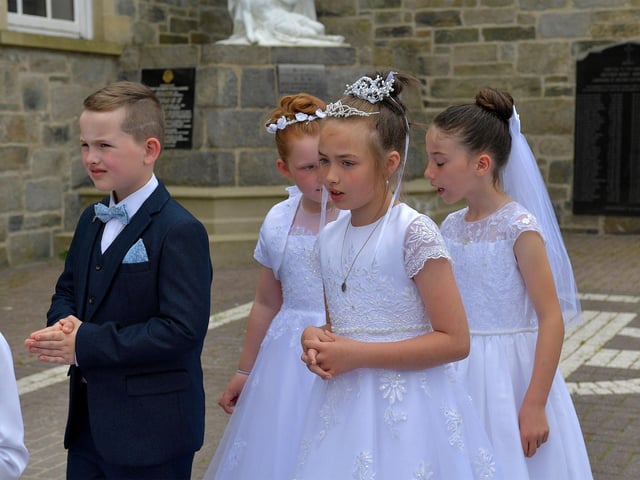 Children from schools in the Long Tower parish, who made their First Holy Communion recently, take part in the Solemnity of Corpus Christi procession, in the ground of the church, on Sunday afternoon. Photo: George Sweeney. DER2324GS –