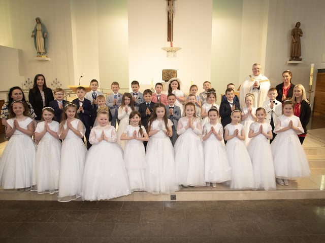 Children from Holy Child Primary School who received the Sacrament of First Holy Communion from Fr. McFaul at St. Mary's Church, Creggan on Sunday, May 5. Included in photo are Mrs. Pat Concannon, Principal, Ms. Andrea McMenamin, Teacher, and Classroom Assistants Ms. Nicole Gallagher and Ms. Aoife Doherty. (Photos: Jim McCafferty Photography)