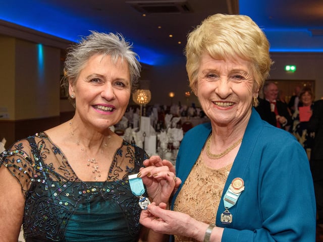 Kate Porter receives her 25 years NODA medal from Sheelagh Hobart. Regional Representative, right during Londonderry Musical Society’s 60th Anniversary dinner in the White Horse Hotel. Picture Martin McKeown. 14.01.23