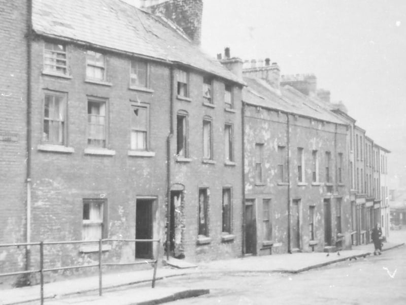 Lower Bridge Street at the junction of Sugarhouse Lane. This section of housing was demolished in the late 1960s, whereas the remainder of the street wasn't pulled down until the early 1970s.