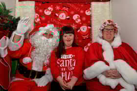Niamh pictured with Santa and one of his helpers at the Christmas Wonderland at Destined, organised by the Western Trust Children’s Disability Team and the Destined Team. Photo: George Sweeney