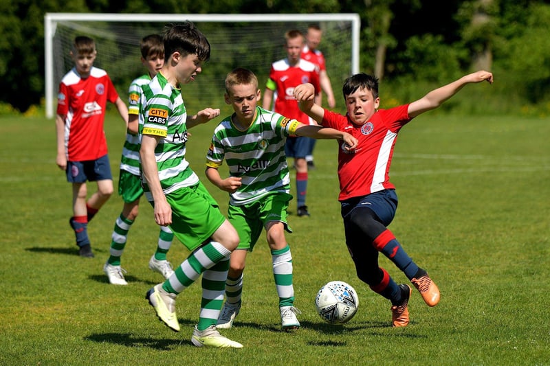 Action from TOTH Celtic against Clooney in the D&D U13 Championship Summer Cup final at Prehen on Sunday morning last. Photo: George Sweeney. DER2322GS - 44