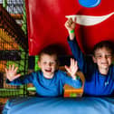 Young boys cheering for free soft play days at High Rise Lisburn