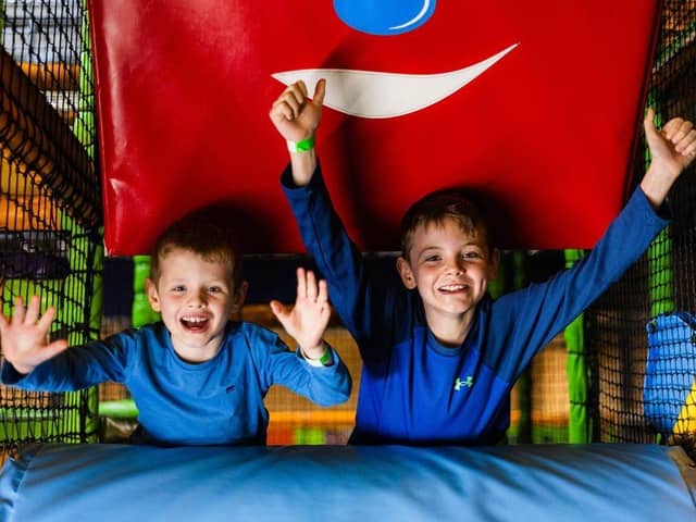 Young boys cheering for free soft play days at High Rise Lisburn