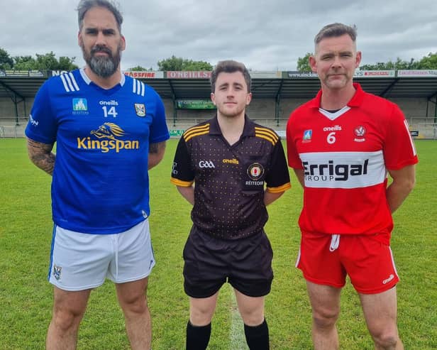 Derry captain Brian Mullan and his Cavan counterpart prior to throw-in at Watty Graham Park.