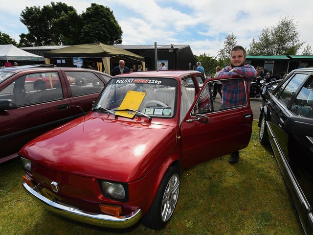 Rafal Tylenda, from Bruncrana, pictured beside his Polski Fiat 126p at the Muff Vintage Show, held in the Community Park on Sunday. Photo: George Sweeney.