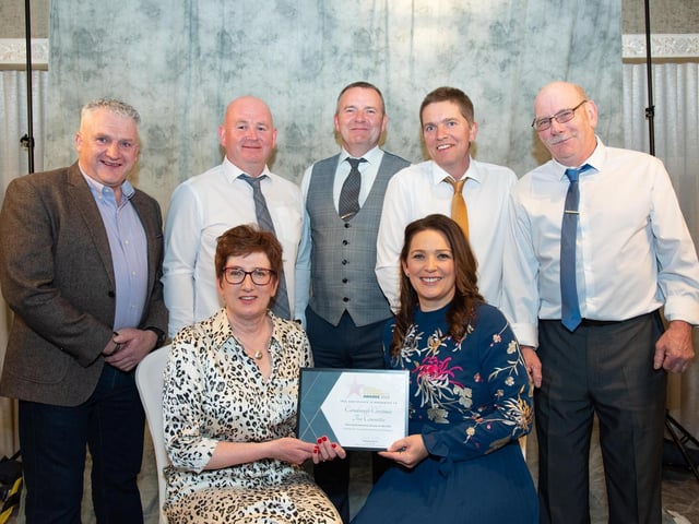 Grainne Gillen Inishowen Credit Union, Award Sponsor presents Sally Kelly, Carndonagh Christmas Tree Committee with The Charity / Community Group of the Year Award from at the Carndonagh Traders Business and Community Awards in the Ballyliffin Lodge Hotel on Saturday night last. Back from left are Eddie Doherty, Philip McLaughlin, SEan Tully, Oliver McLaughlin and Brian Sharkey. Photo Clive Wasson.
