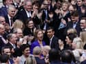 Rishi Sunak is congratulated as he arrives at Conservative party HQ in Westminster, London, after it was announced he will become the new leader of the Conservative party after rival Penny Mordaunt dropped out.