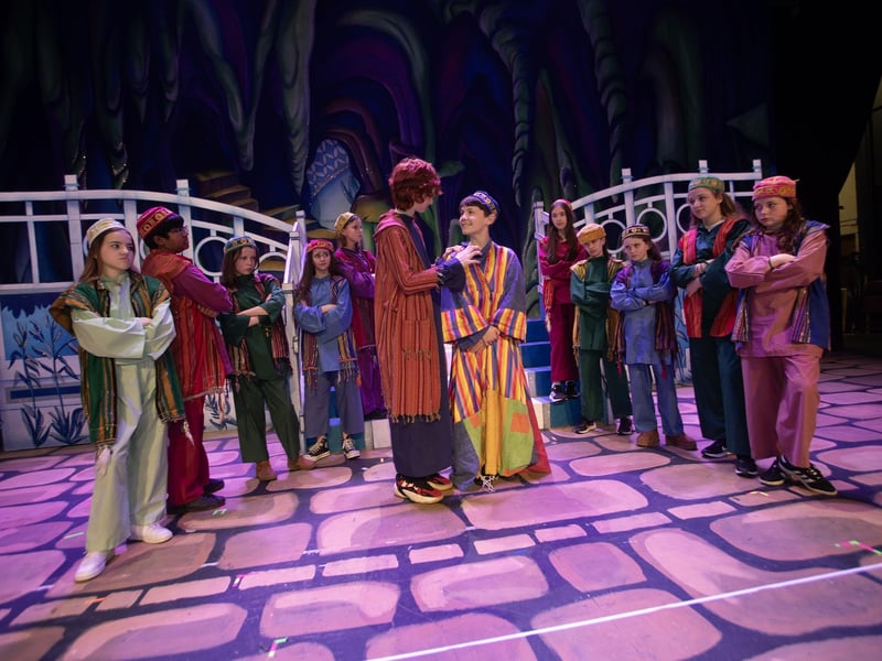 Year 8 pupils in Joseph and His Amazing Technicolour Dream Coat at the Millennium Forum.