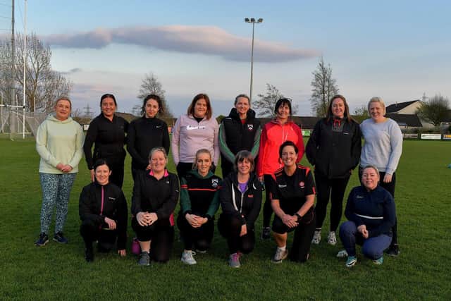 Some of the participants who took part in Doire Trasna’s first Mothers and Others football practice session, at Corrody Road. Photo: George Sweeney. DER2316GS – 06