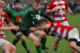 David Lapsley of City of Derry bursts through the Randlestown cover to score a first half try. Photo: George Sweeney