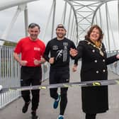 Derry City and Strabane District Council Mayor, Councillor Patricia Logue is joined on the new Pennyburn Bridge by athletes, Patrick McCarry, Kyle Doherty, last years winner and Louise Wilkinson at the launch of the 2024 event which is taking place on Sunday, September 1st. Picture Martin McKeown. 30.04.24