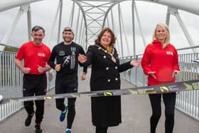 Derry City and Strabane District Council Mayor, Councillor Patricia Logue is joined on the new Pennyburn Bridge by athletes, Patrick McCarry, Kyle Doherty, last years winner and Louise Wilkinson at the launch of the 2024 event which is taking place on Sunday, September 1st. Picture Martin McKeown. 30.04.24
