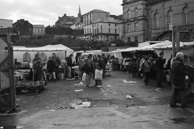 Shoppers and traders at the market on Foyle Street