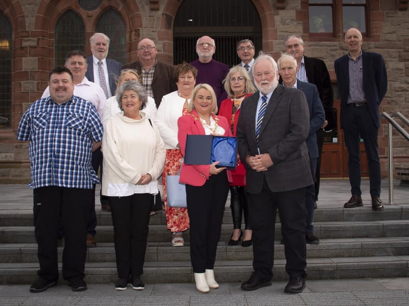 The Mayor of Derry City and Strabane District Council, Sandra Duffy making a presentation to former Derry Journal editor Pat McArt at the Guildhall on Wednesday evening, in recognition of his contribution and commitment to journalism in the city and district. Included are family and former Derry Journal colleagues.