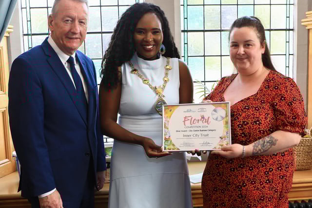 Mayor Lilian Seenoi Barr presents the City Centre Initiative Floral Competition 2024 Silver Award (City Centre Business Category) to Joanne Clarke (Inner City Trust). Included, Jim Roddy, CEO of City Centre Initiative. (Photo - Tom Heaney, nwpresspics)