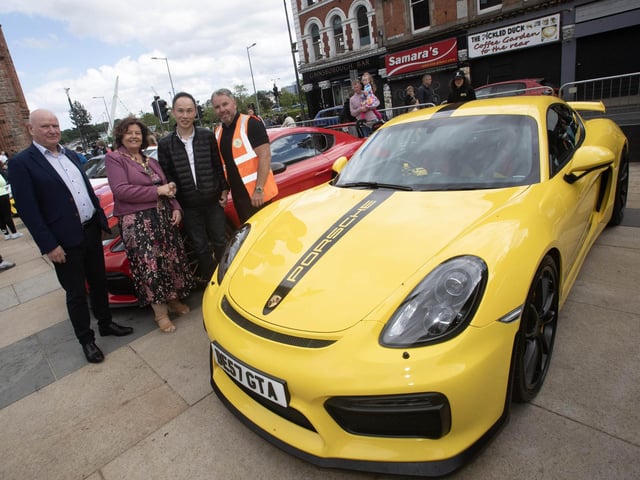 The Mayor, Patricia Logue welcoming Eric Lee and his yellow Porsche into Guildhall Square on Saturday. Included is James Logue, the Mayor's husband and event organiser, Gary McCaul.