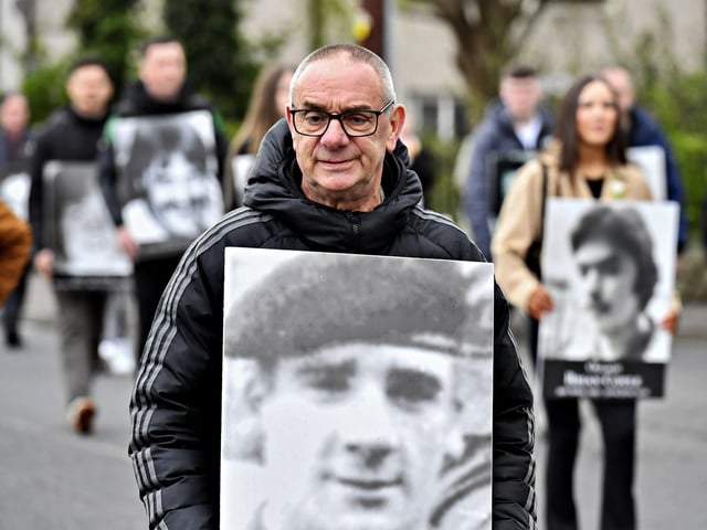 Thomas Starrs carries a photograph of his broth John, who was killed in May 1972, at the commemoration of the 109th anniversary of the Easter Rising on Sunday afternoon. Photo: George Sweeney