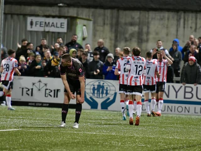 Will Patching and Michael Duffy celebrate as Derry City turn the screw on Dundalk. Photographs by Kevin Morrison