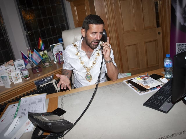 Micky gets to try out the Mayor’s chair in the parlour on Thursday evening.