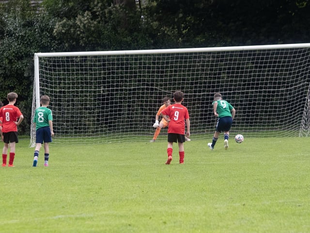 Antrim Academy striker Corey Carroll dispenses this penalty to put his side 1-0 up against Altrincham in the u-12 Foyle Cup group game at St. Columb's Park on Wednesday afternoon. (Photo: Jim McCafferty Photography)