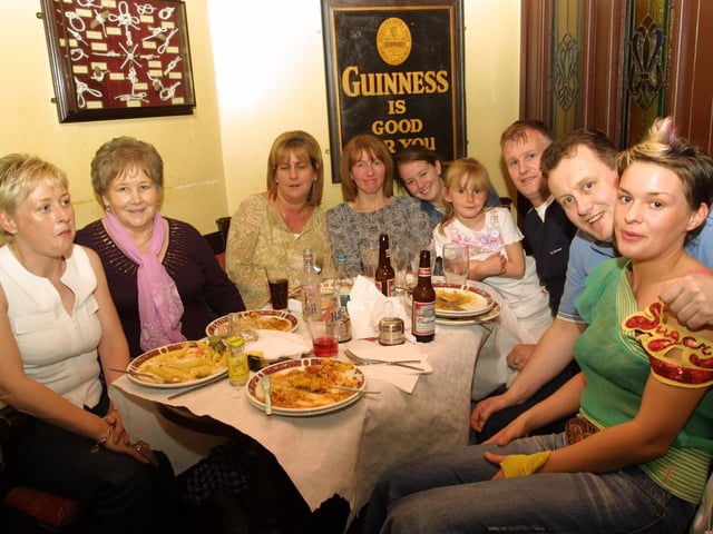 Family and friends enjoying a meal at Duke's Bar