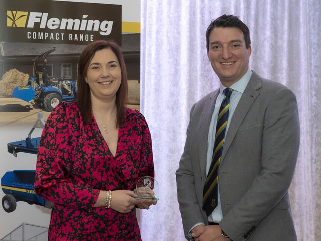 Newbuildings' Laura Mcgarrigle receives the Ladies' Championship batting award from Peter McCartney.