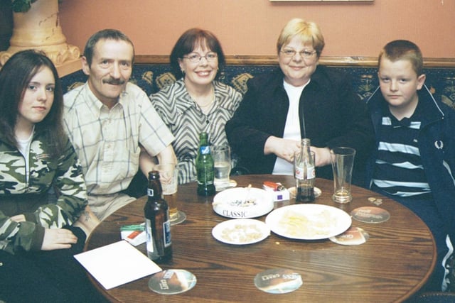 Marie, Jimmy and Emma McCourt pictured with Lucia and Christopher Marsland at the birthday party in the Argyle Arms. 290503HG9