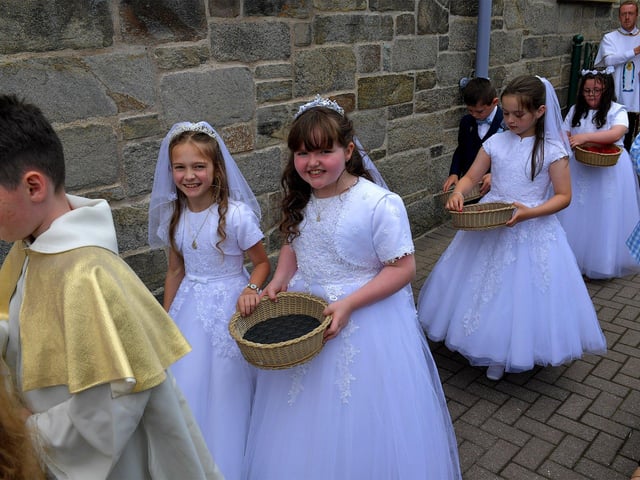 Children from schools in the Long Tower parish, who made their First Holy Communion recently, take part in the Solemnity of Corpus Christi procession, in the ground of the church, on Sunday afternoon. Photo: George Sweeney. DER2324GS –