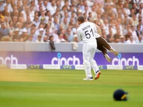 England's Johnny Bairstow carrying a Just Stop Oil protestor off the pitch  during day one of the second Ashes test match at Lord's, London. Adam Davy/PA Wire.