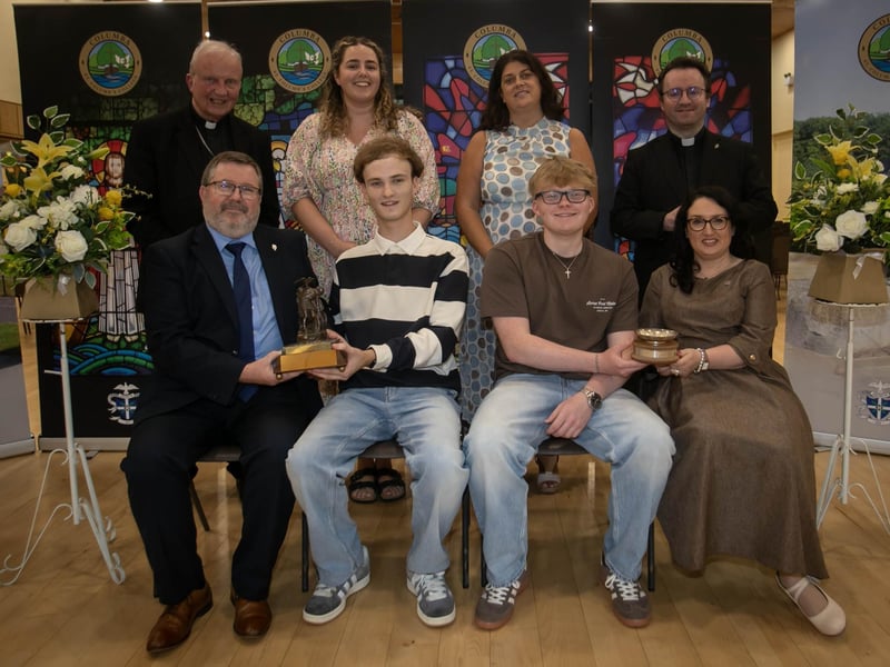 Mr John Johnston, Vice Principal, St. Columb's College presenting the Trinidad Valencera Prize for Spanish to Aaron O Doherty, and Fionn Johnson, receiving the Duais Chlub Dhoire Cholmcille Don Ghaeilge prize from Mrs Caroline McLaughlin (Principal) on Thursday evening. At back from left are Bishop Donal McKeown, Ms Claire Keany (Head of Irish), Mrs Patrice McConnell (Senior Teacher), and Fr Stephen Ward (School Chaplain). : .
