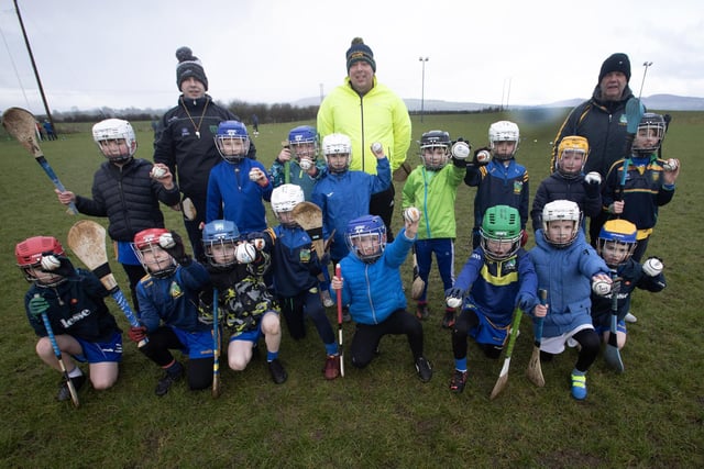 Beart coaches Jude Campbell, Conor McLaughlin and Fergal Grant pictured with the Beart U8 hurlers.